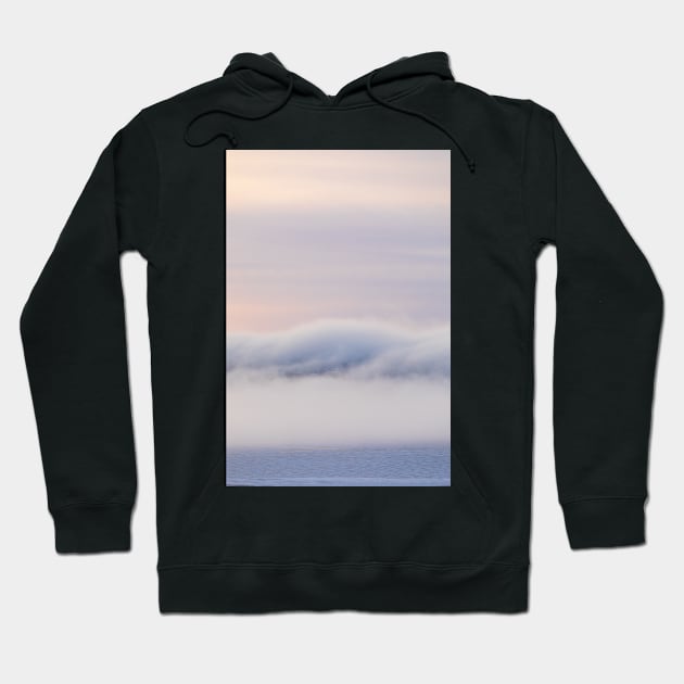 Dreamy thick fog at sunrise over hill Hoodie by Juhku